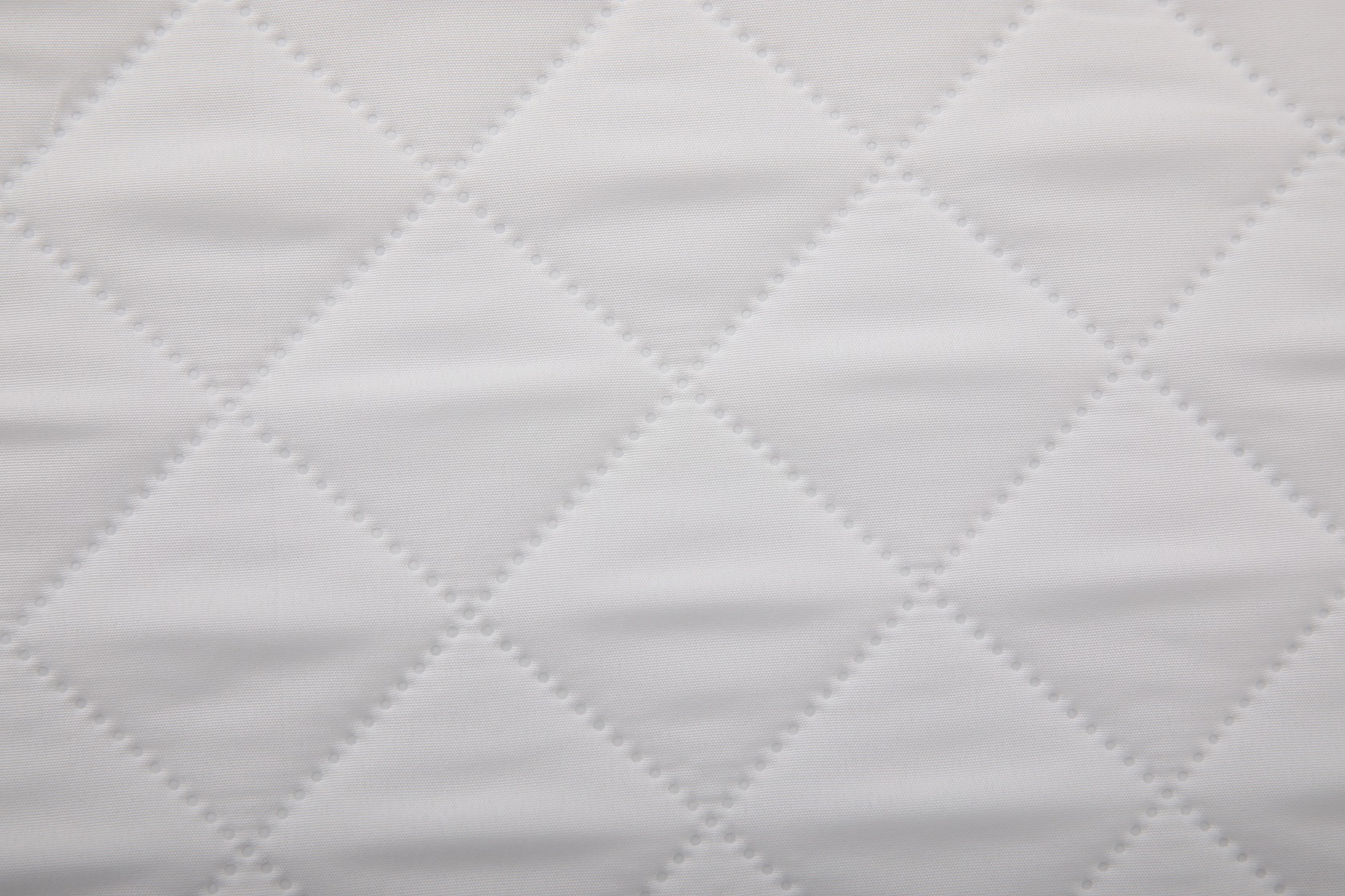White square-embossed fabric close-up